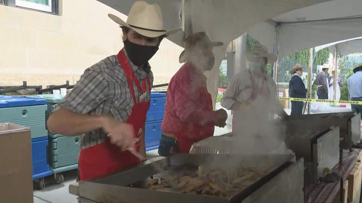 Volunteers served up sausages and pancakes at the premier’s pancake breakfast on Monday, July 12.