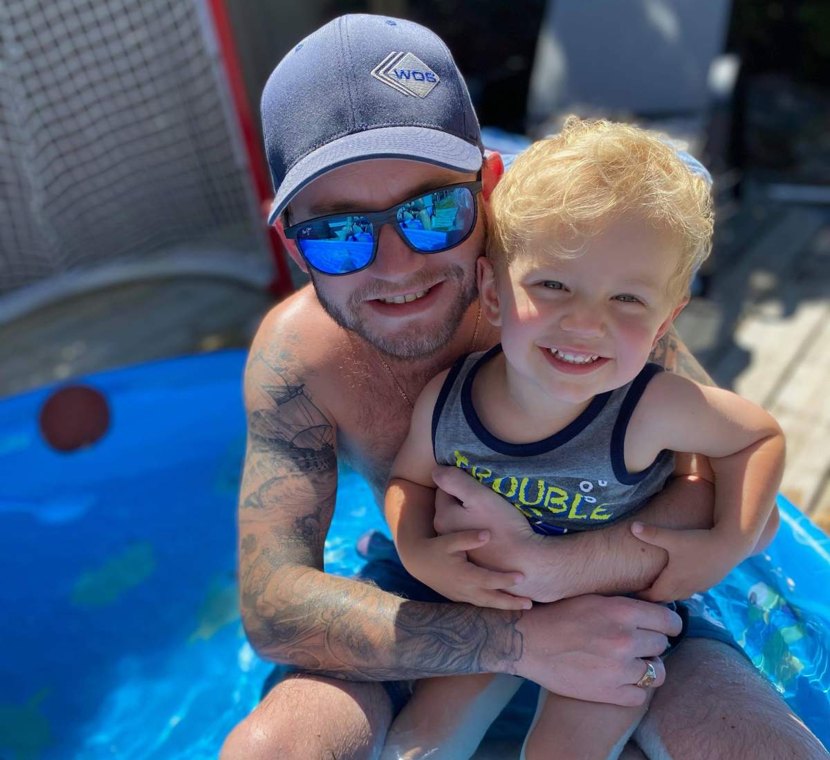 Bradley Ker is pictured with his 2-year-old son.