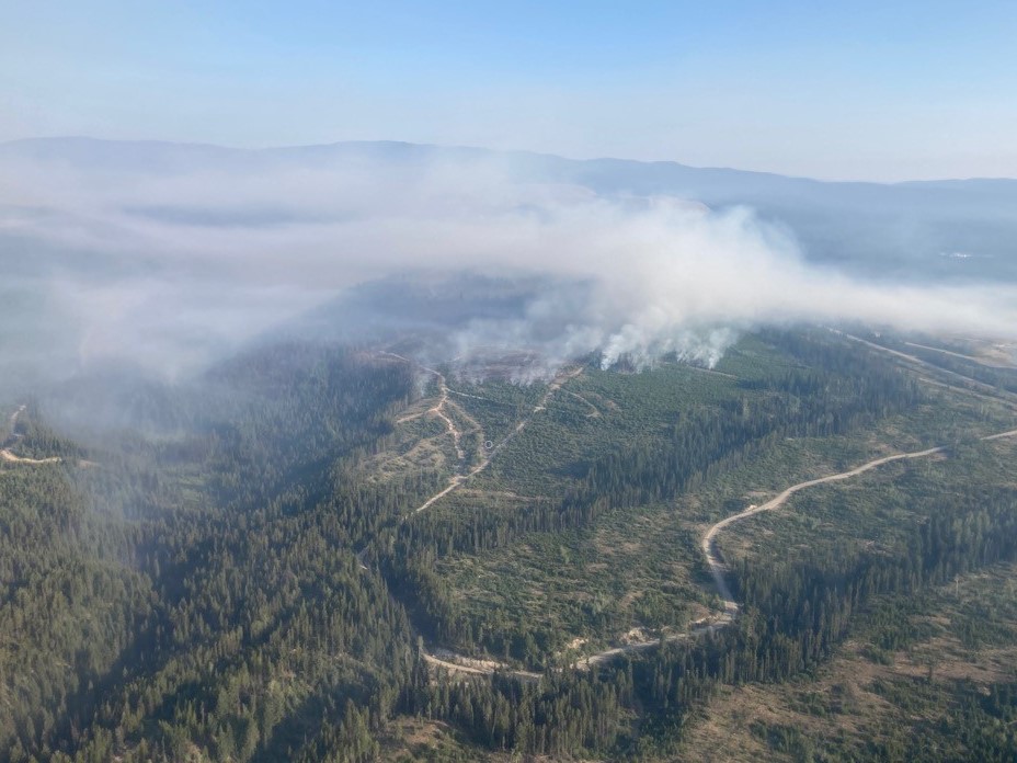 Smoke rises from the Brenda Creek wildfire that’s burning near the Okanagan Connector. According to the BC Wildfire Service, smoky conditions and windy skies are preventing accurate wildfire mapping.