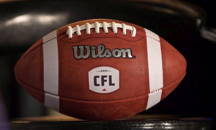 A football with the CFL logo sits on a chair during media conference in Winnipeg, Friday, November 27, 2015. 