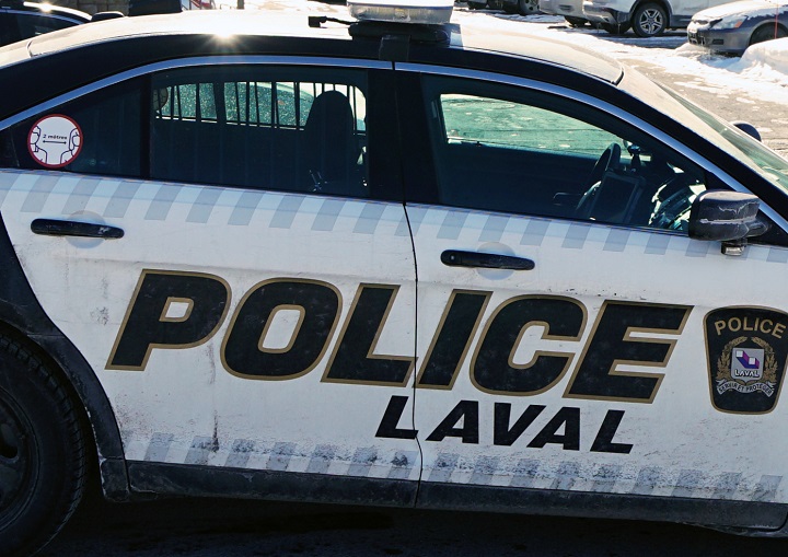 Laval police cruiser at a crime scene in Laval, Que.