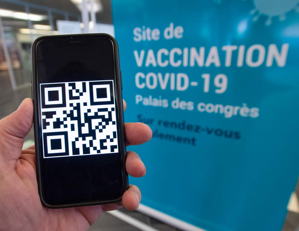 A QR code is seen on a smartphone at a COVID-19 vaccination clinic, Thursday, May 13, 2021  in Montreal. The Quebec government will be sending a personalized QR code to all vaccinated Quebecers.