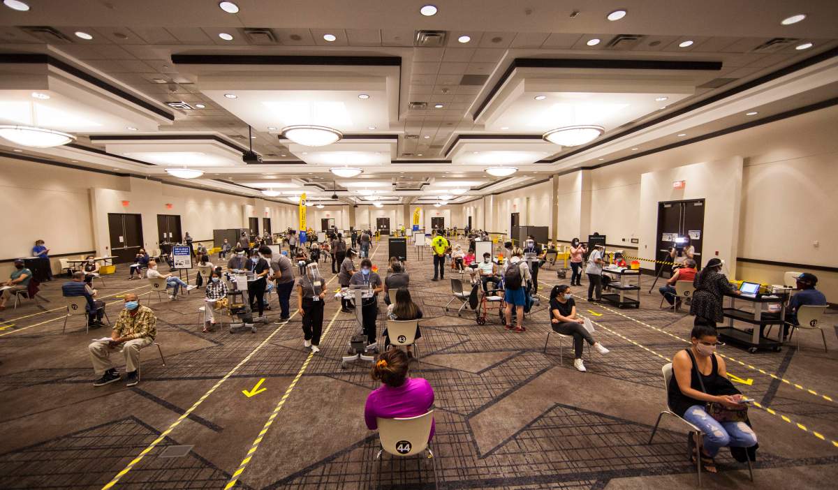 MISSISSAUGA , May 16, 2021  People get vaccinated at a vaccination clinic at the International Centre in Mississauga, Ontario, Canada, on May 13, 2021..  A non-stop marathon vaccination event called ''Doses After Dark'' took place here starting on Saturday. It plans to administer more than 7,600 doses over the 32 hours. (Photo by Zou Zheng/Xinhua) (Credit Image: © Zou Zheng/Xinhua via ZUMA Press).