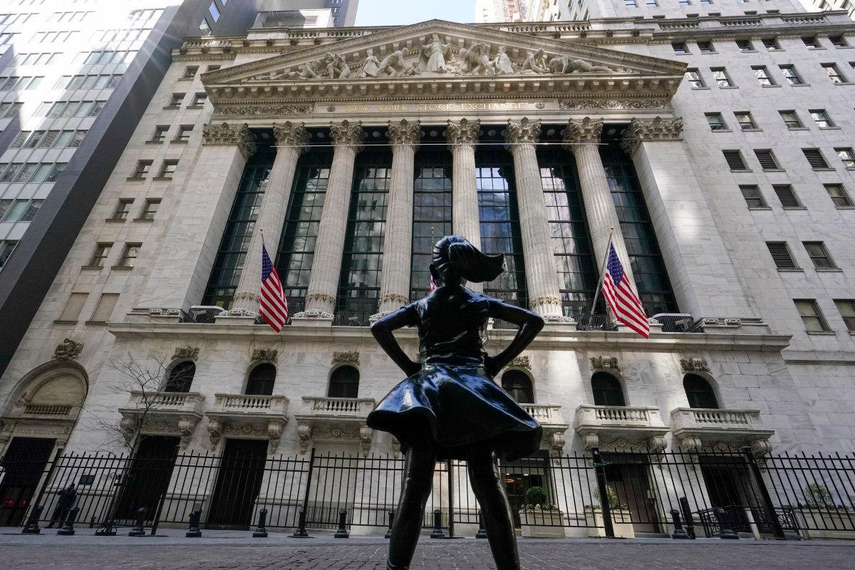 FILE - In this March 23, 2021 file photo, the Fearless Girl statue stands in front of the New York Stock Exchange in New York's Financial District.