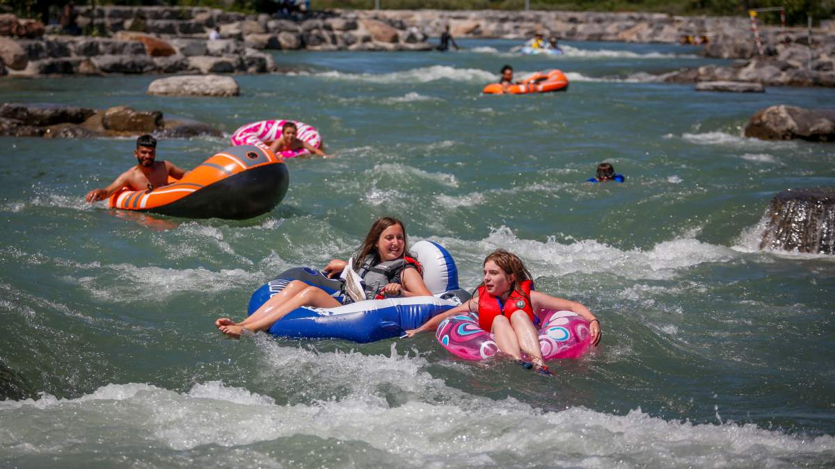 People raft in the Bow River trying to beat the heat in Calgary, Alta., Wednesday, June 30, 2021.