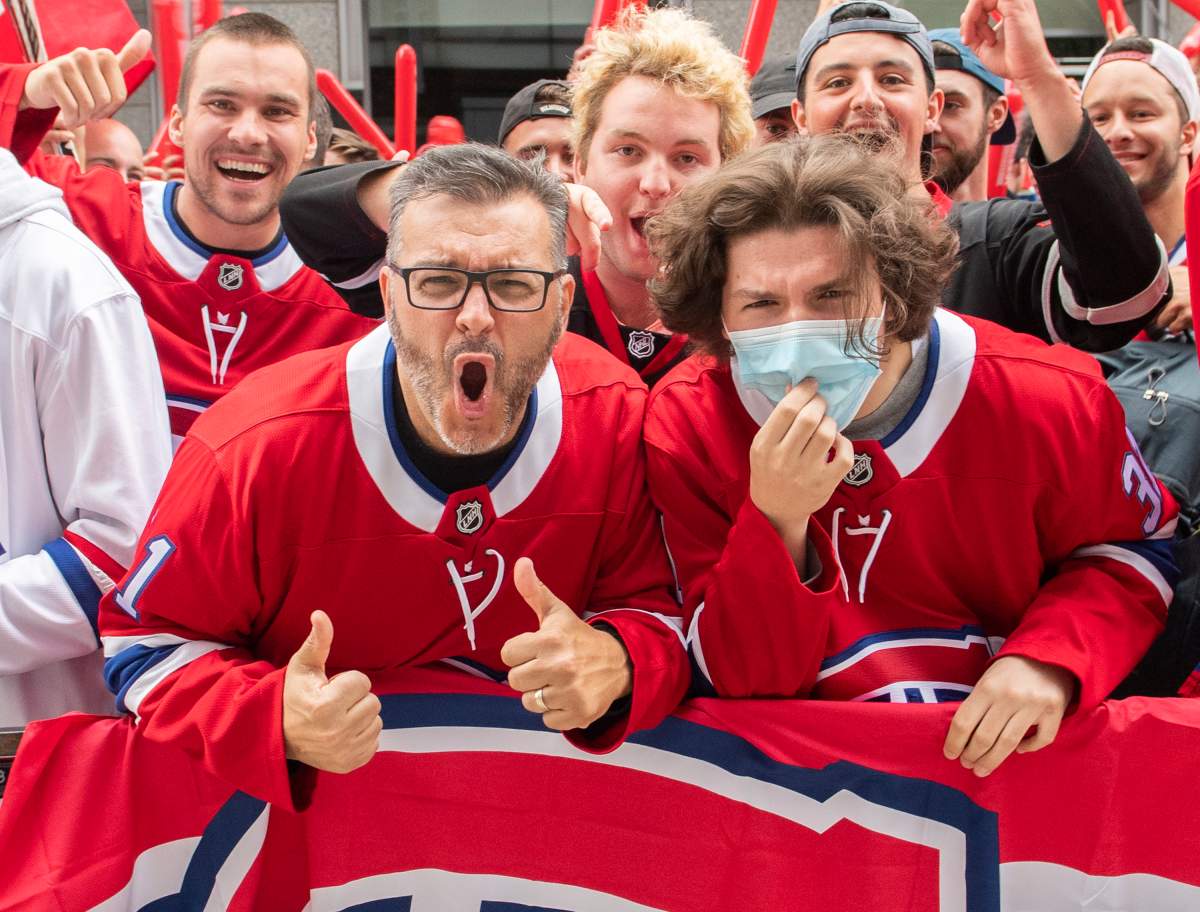 Montreal Canadiens fans cheer on their team outside the Bell Centre in Montreal, Friday, July 2, 2021, prior to Game 3 of the NHL Stanley Cup final against the Tampa Bay Lightning.