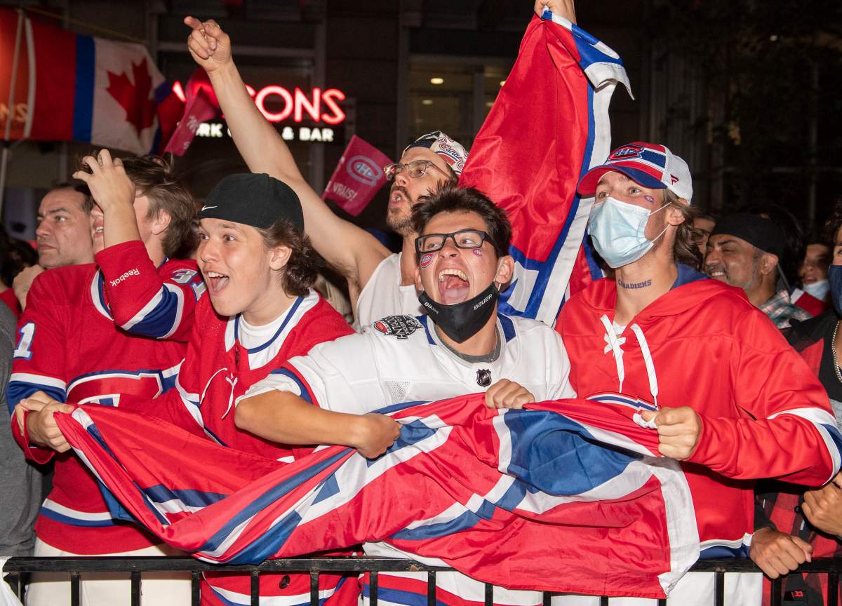 Montreal Canadiens fans react during second period Game 4 Stanley Cup finals action against the Tampa Bay Lightning, outside the Bell Centre in Montreal on Monday.