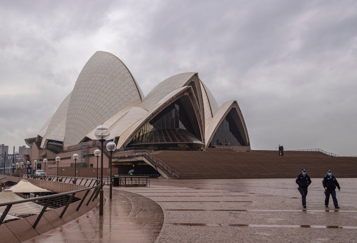 SYDNEY, July 9, 2021  Police officers patrol in front of Sydney Opera House in Sydney, Australia, on July 9, 2021.