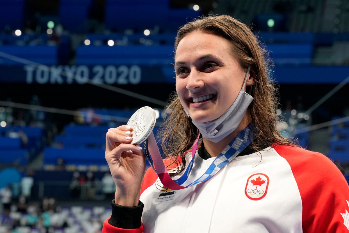 Canada's Kylie Masse poses with her silver medal won in the women's 100m backstroke final event during the Tokyo Summer Olympic Games, in Tokyo, Tuesday, July 27, 2021. THE CANADIAN PRESS/Frank Gunn.