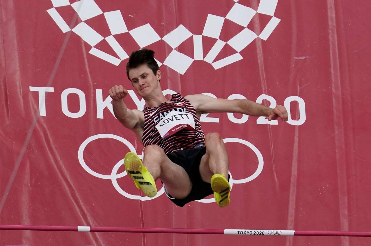 Django Lovett, of Canada, competes during a preliminary round of the men's high jump at the 2020 Summer Olympics, Friday, July 30, 2021, in Tokyo. (AP Photo/Morry Gash).