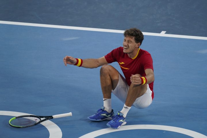 Pablo Carreno Busta, of Spain, reacts after defeating Novak Djokovic, of Serbia, in the bronze medal match of the tennis competition at the 2020 Summer Olympics, Saturday, July 31, 2021, in Tokyo, Japan.