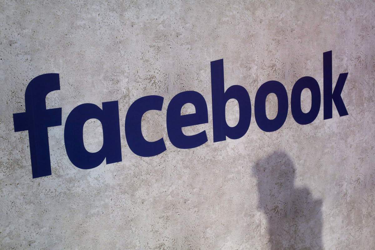 FILE - This Jan. 17, 2017, file photo shows a Facebook logo displayed in a start-up companies gathering at Paris' Station F in Paris.