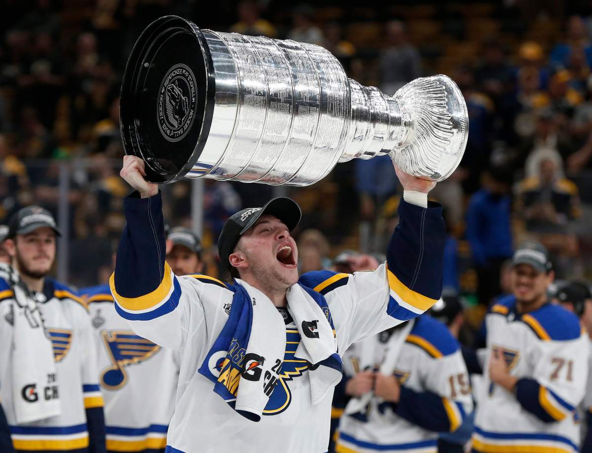 The St. Louis Blues’ Vince Dunn carries the Stanley Cup after the Blues defeated the Boston Bruins in Game 7 of the NHL Stanley Cup final, Wednesday, June 12, 2019, in Boston. (AP Photo/Michael Dwyer)