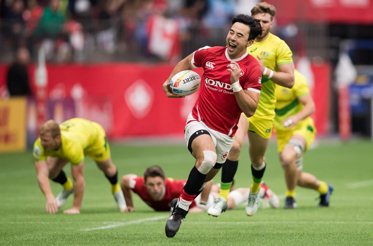 Canada’s Nathan Hirayama, front, runs the ball towards the try zone before passing to Harry Jones, who scored, during a semifinal match against Australia at the Canada Sevens rugby tournament in Vancouver, on Sunday, March 8, 2020. THE CANADIAN PRESS/Darryl Dyck