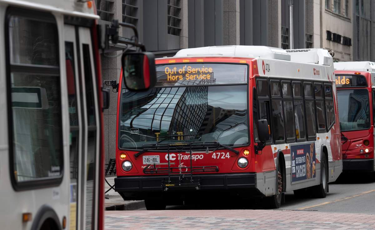 OC Transpo buses line up along a street in Ottawa,  Thursday April 16, 2020. 