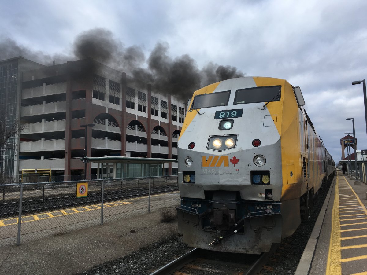 FILE - A smoking Via Rail engine is shown as it idles at the Oakville, Ont. train station on March 22, 2019. 