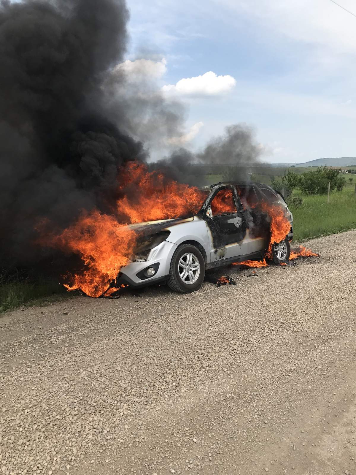 A burned out car found near Cochrane is linked to the investigation into the fatal shooting of a man and his dog in the Calgary community of Crestmont.