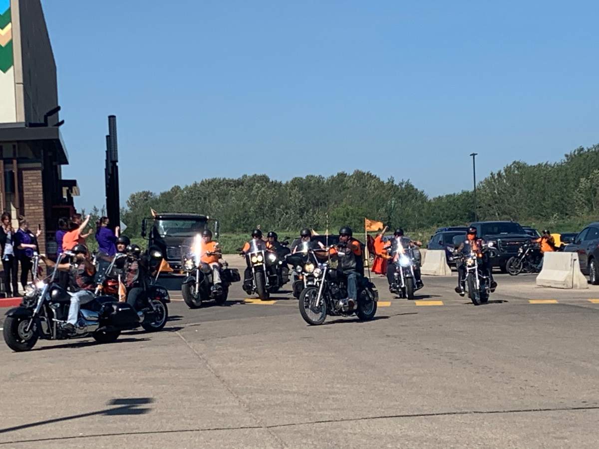 About 100 people in the Legacy Run outside of Edmonton in support of those impacted by residential schools, July 1, 2021. 