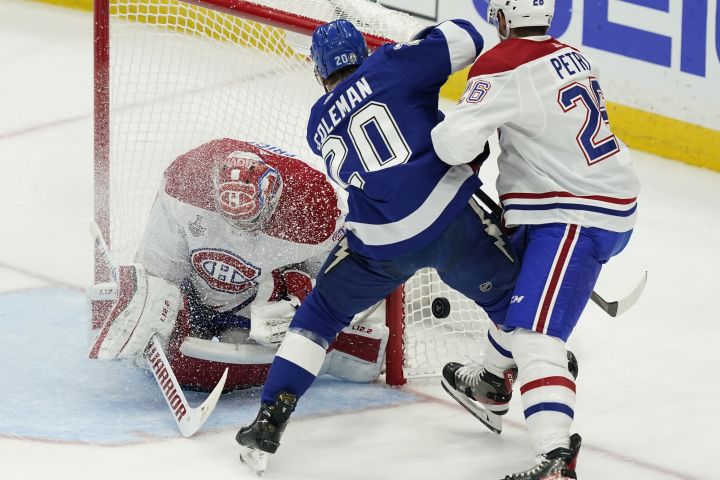 Montreal Canadiens defenseman Jeff Petry (26) checks Tampa Bay Lightning center Blake Coleman (20) next to Canadiens goaltender Carey Price (31) during the first period in Game 5 of the NHL hockey Stanley Cup finals, Wednesday, July 7, 2021, in Tampa, Fla.