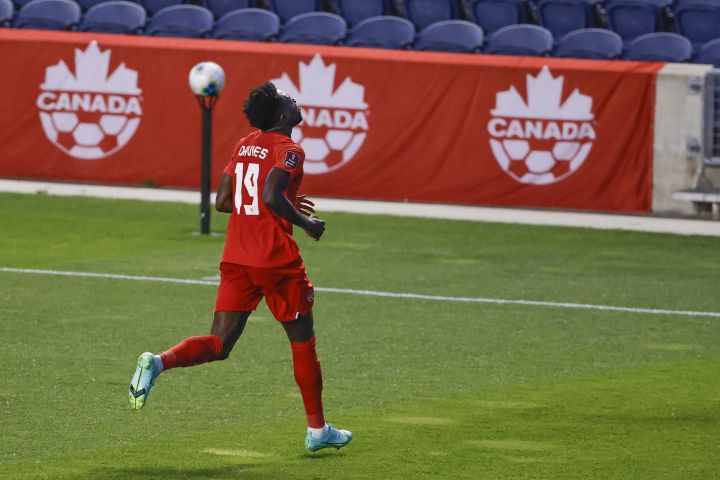 Canada's Alphonso Davies celebrates after scoring against Suriname during the first half of a World Cup 2022 Group B qualifying soccer match Tuesday, June 8, 2021, in Bridgeview, Ill. 