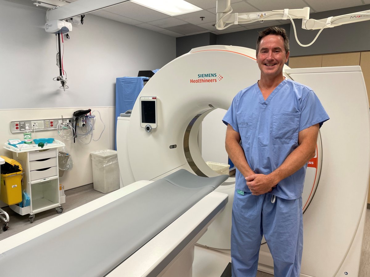 Dr. Jamie McNabb, general surgeon, stands alongside the new CT scanner at Ross Memorial Hospital in Lindsay, Ont.