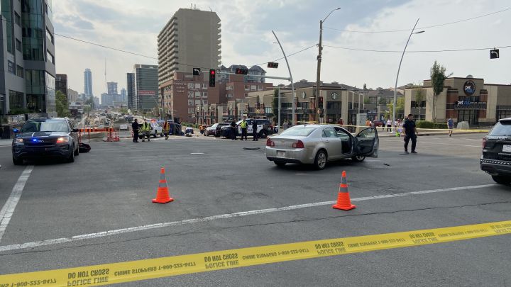 Police respond to what appears to be a crash at Jasper Avenue and 109 Street in Edmonton on Friday.