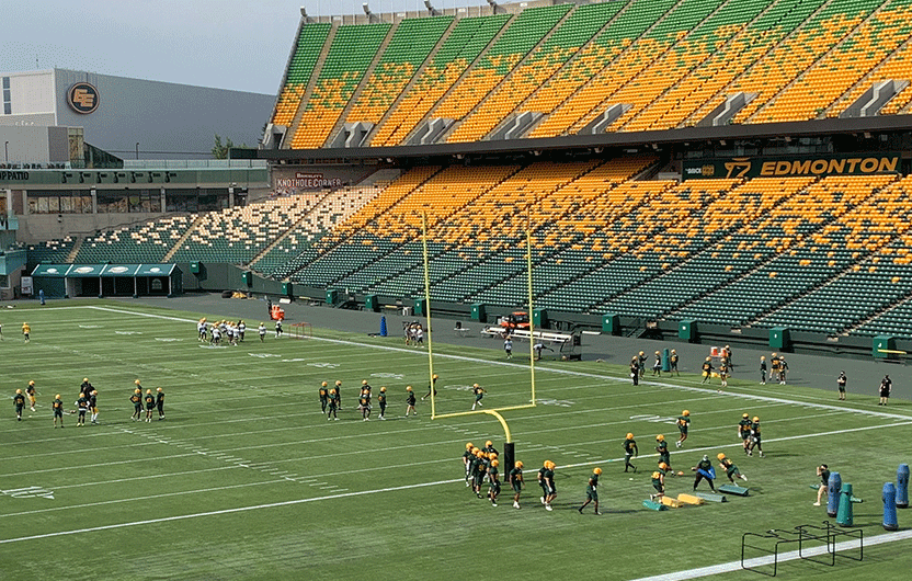 Members of the Edmonton Elks on the Brick Field at Commonwealth Stadium for training camp.