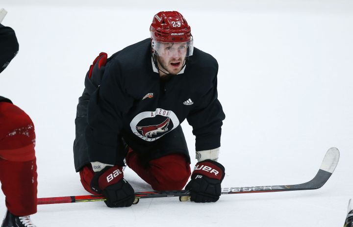 Arizona Coyotes defenseman Oliver Ekman-Larsson pauses on the ice during NHL hockey practice at Gila River Arena, Monday, July 13, 2020, in Glendale, Ariz.