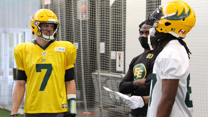 Edmonton Elks receiver Derel Walker speaks with quarterback Trevor Harris and receiver Armanti Edwards during training camp on Monday, July 19, 2021.