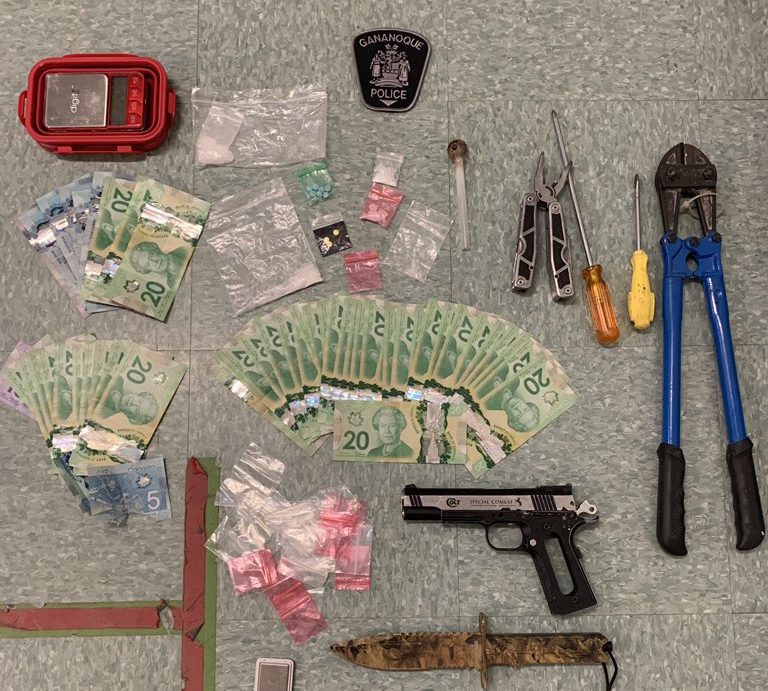 Four people are facing charges after police say they found large amounts of drugs, cash, a replica handgun and break in materials in their vehicle. 