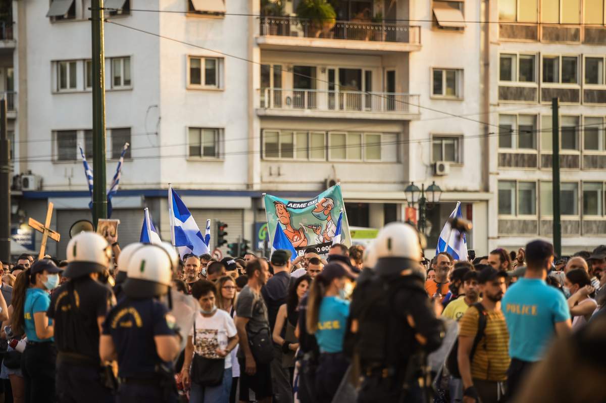 ATHENS, GREECE – JULY 14: Anti-vaccine protesters take part in a rally on July 14, 2021 in front of the Greek parliament in Athens, Greece two days after the government announced mandatory Covid-19 vaccinations for all health workers. (Photo by Dimitris Lampropoulos/Anadolu Agency via Getty Images)