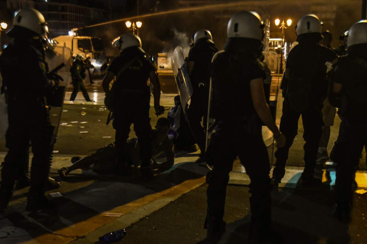 ATHENS, GREECE – JULY 24: Greek police detain anti-vaccine protesters during a rally at Syntagma square, central Athens, on Saturday, July 24, 2021. Thousands of people protested against Greek government’s measures to curb rising COVID-19 infections. (Photo by Dimitris Lampropoulos/Anadolu Agency via Getty Images)
