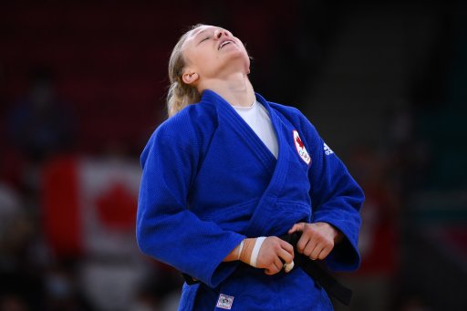 Canada’s Jessica Klimkait reacts after defeating Slovenia’s Kaja Kajzer in the judo women’s -57kg bronze medal B bout during the Tokyo 2020 Olympic Games at the Nippon Budokan in Tokyo on July 26, 2021.