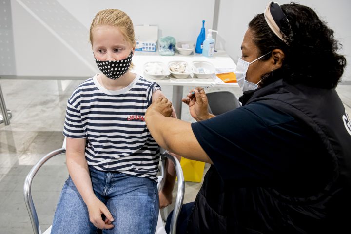UTRECHT, NETHERLANDS - JULY 9: A child is seen while receiving a coronavirus vaccination on July 9, 2021 in Utrecht, Netherlands. (Photo by Patrick van Katwijk/BSR Agency/Getty Images).
