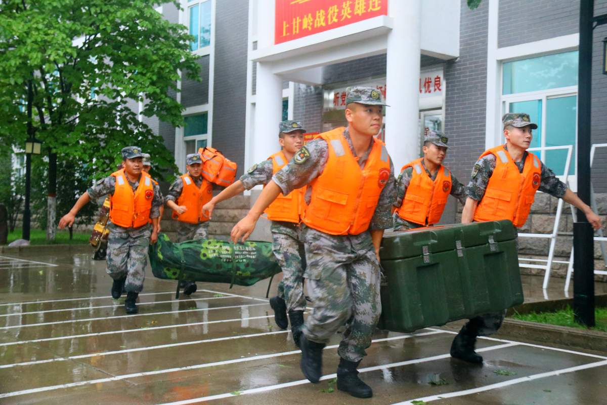 Soldiers of the Chinese People’s Liberation Army (PLA) load rescue equipment onto a truck before heading to the flood-hit areas on July 20, 2021 in Luoyang, Henan Province of China. Torrential rains hit Henan since July 16, causing floods in many parts of the province on Monday and Tuesday.