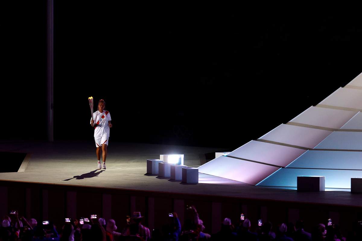 Naomi Osaka of Japan carries the torch to the Cauldron during the Opening Ceremony of the Tokyo 2020 Olympic Games at Olympic Stadium on July 23, 2021 in Tokyo, Japan.