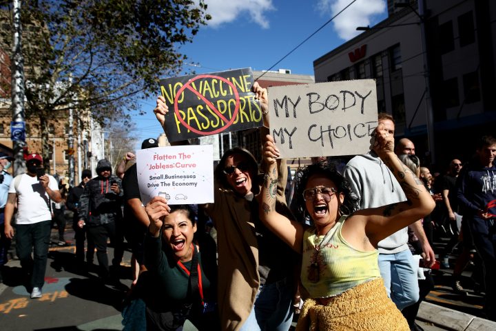 Protesters march down George St on July 24, 2021 in Sydney, Australia. Anti-lockdown and anti-vaccination activists gathered in cities across Australia with New South Wales and Victoria are under strict Covid-19 restrictions as the states continue to fight the spread of the delta coronavirus strain.