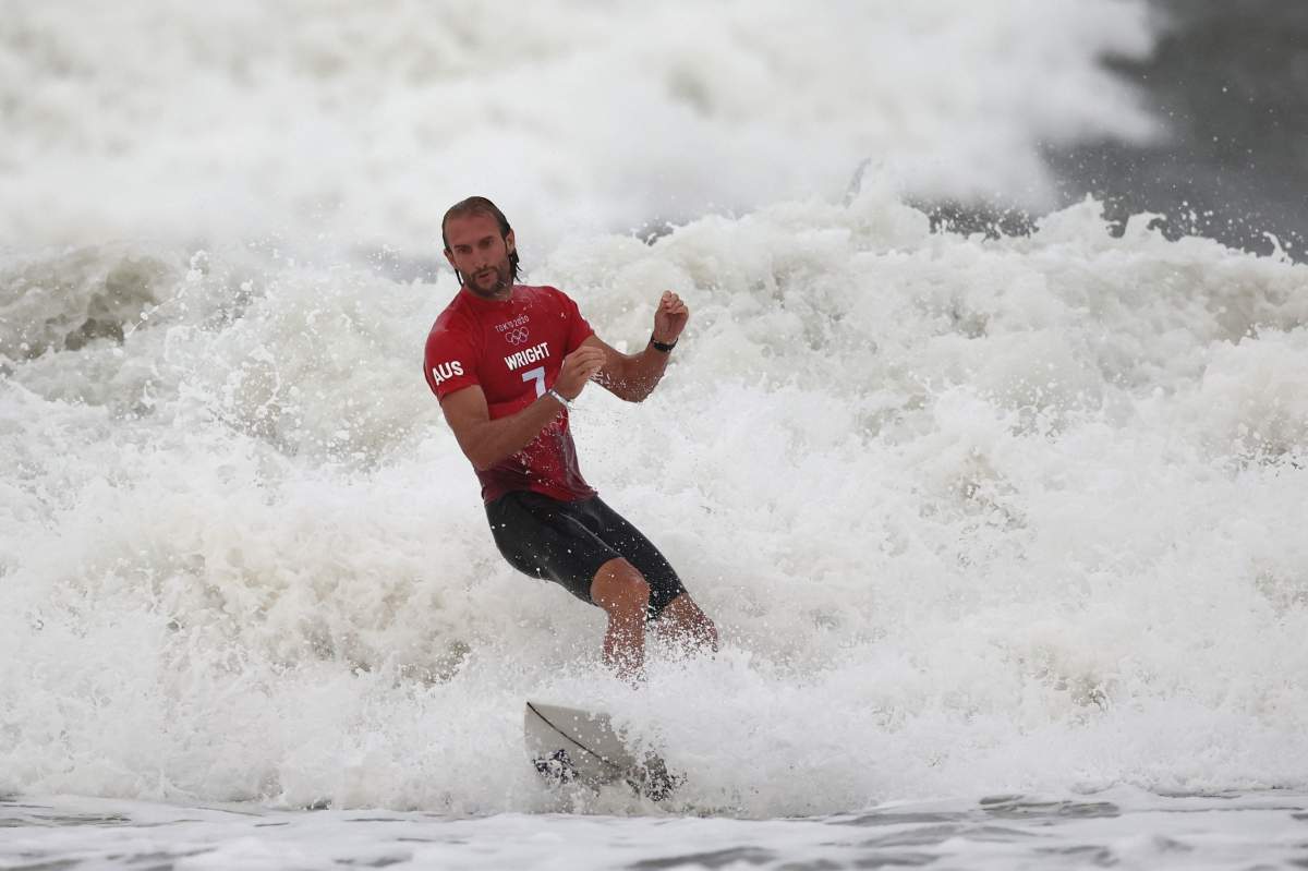 Owen Wright of Team Australia shows emotion after riding a wave during his men's round 3 heat on day three of the Tokyo 2020 Olympic Games at Tsurigasaki Surfing Beach on July 26, 2021 in Ichinomiya, Chiba, Japan. 