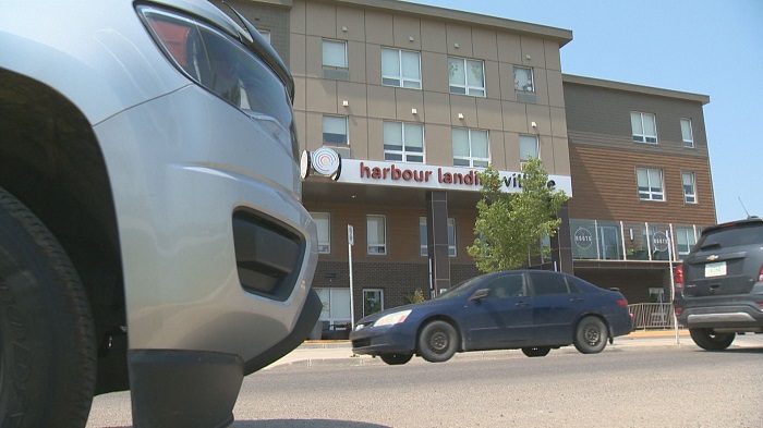 Vehicles drive by Harbour Landing Village located on 4000 James Hill Road in Regina, Sask.