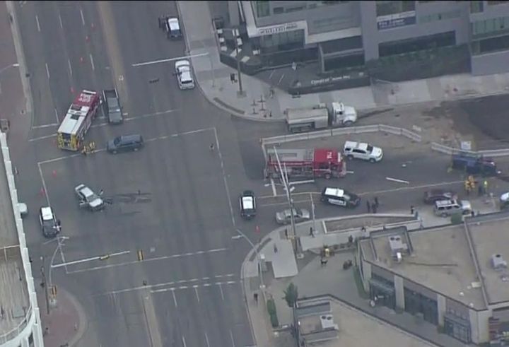 Emergency vehicles respond to what appears to be a crash at Jasper Avenue and 109 Street in Edmonton on Friday.