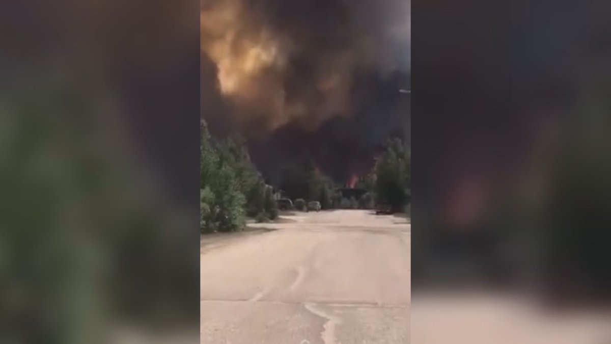 A screenshot from a cell phone video shows a large wildfire near the town on Lynn Lake in northern Manitoba.