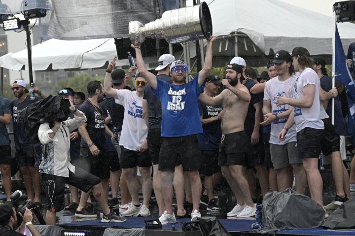 Tampa Bay Lightning centre Steven Stamkos hoists the Stanley Cup during the NHL hockey Stanley Cup champions’ championship celebration after their boat parade, Monday, July 12, 2021, in Tampa, Fla.