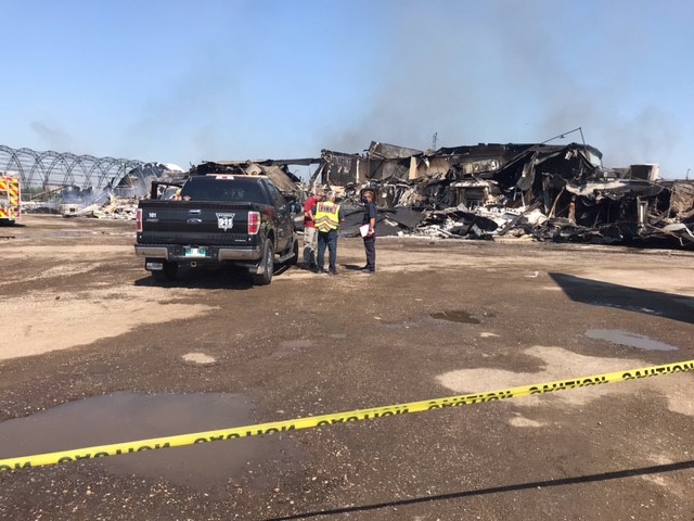 A building near Oak Bluff, Man., just west of Winnipeg, is said to be a total loss in the millions of dollars following a dramatic fire that sprang up Wednesday.