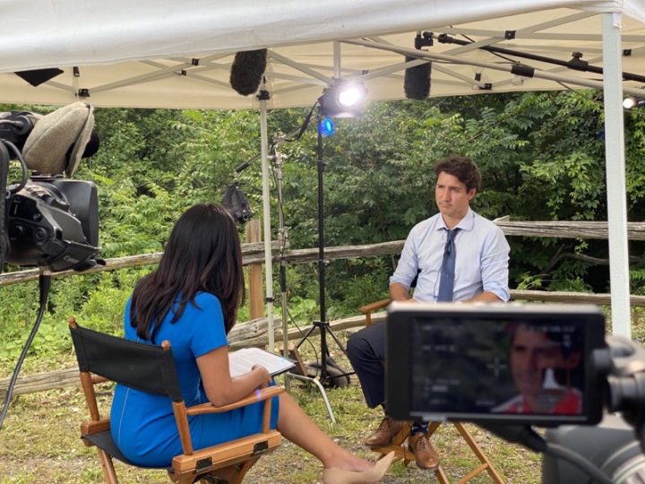 Trudeau speaking with Global News reporter Farah Nasser at the Heart Lake Conservation Park in Brampton, Ont.