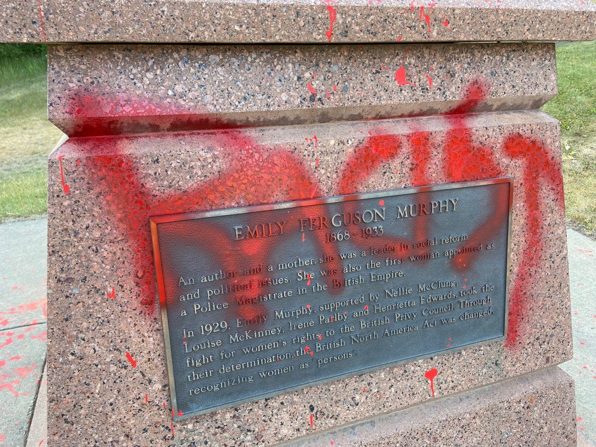 The Emily Murphy statue in Edmonton defaced with red paint and the word "racist" Tuesday, July 13, 2021.