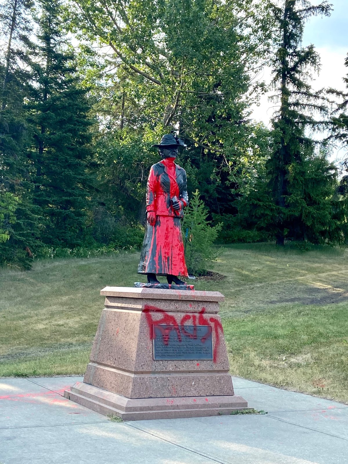 The Emily Murphy statue in Edmonton defaced with red paint and the word "racist" Tuesday, July 13, 2021.