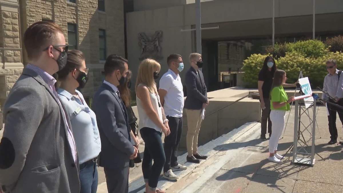 Members of the Calgary Students Alliance and Ward 8 Coun. Evan Woolley, pictured on July 13, 2021, are calling on Elections Calgary to reverse its decision and allow “vote anywhere” advance polling in the 2021 municipal election.