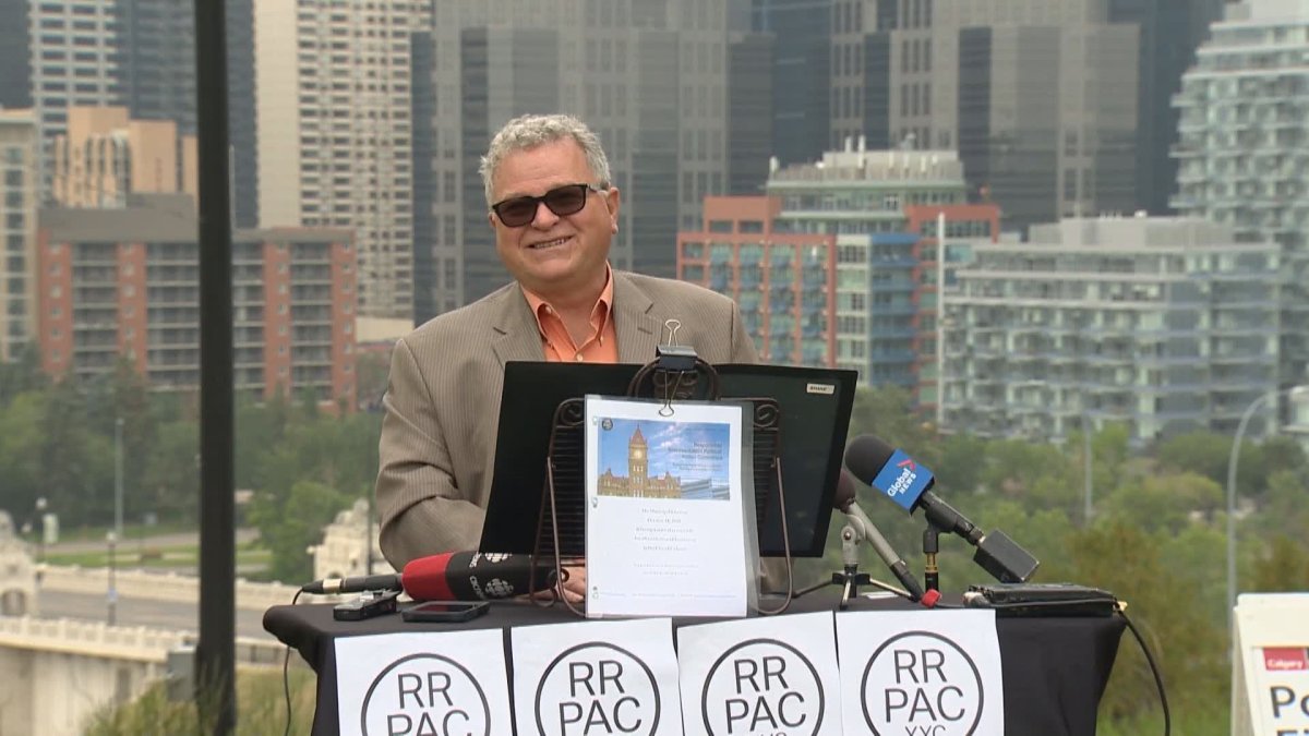 Calgary Councillor Shane Keating stands in front of downtown Calgary to announce the founding of the Responsible Representation Political Action Committee on July 21, 2021.