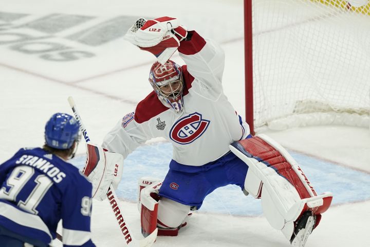 Montreal Canadiens goaltender Carey Price (31) makes a save during the second period in Game 1 of the NHL hockey Stanley Cup finals against the Tampa Bay Lightning, Monday, June 28, 2021, in Tampa, Fla.