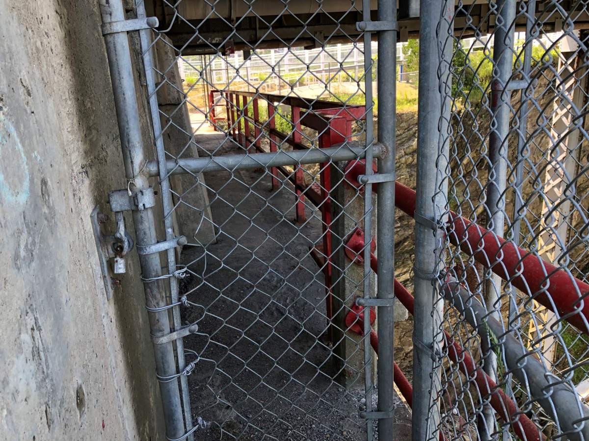 A cement walkway under Reversing Falls Bridge in Saint John, N.B. A provincial spokesman says the walkway is for maintenance staff, not pedestrians.